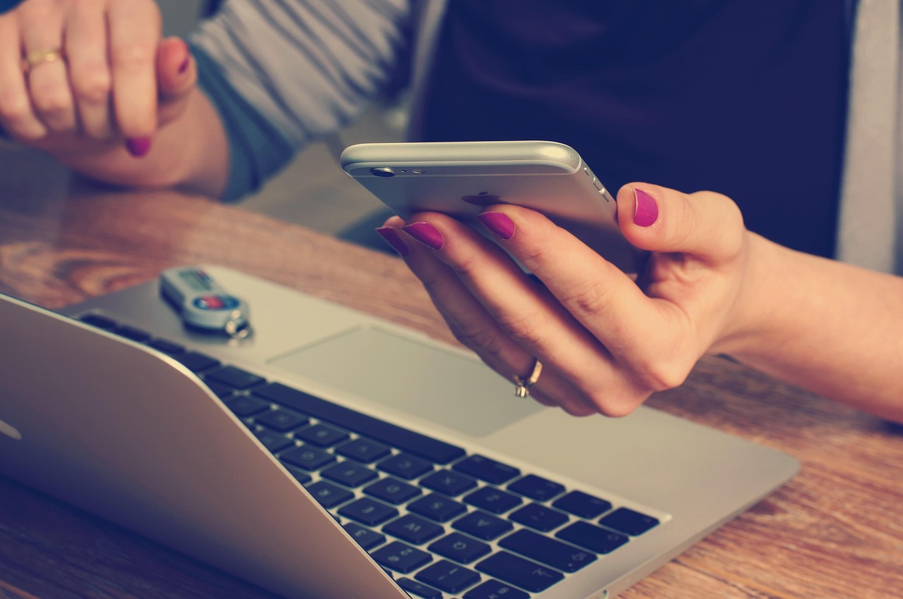 Startup founder sending USDC payroll to remote Web3 workers worldwide using multiple devices, illustrating step-by-step crypto payroll process