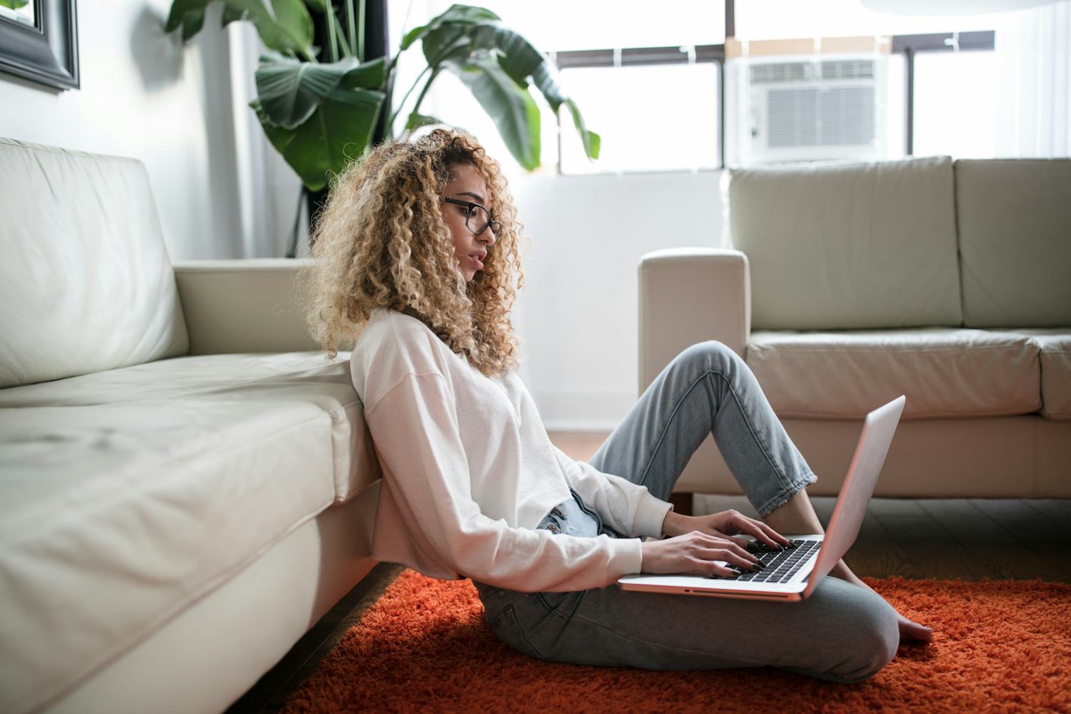 Digital nomads collaborating on laptops and receiving instant USDC crypto payroll notifications, representing global remote team payments in 2025.