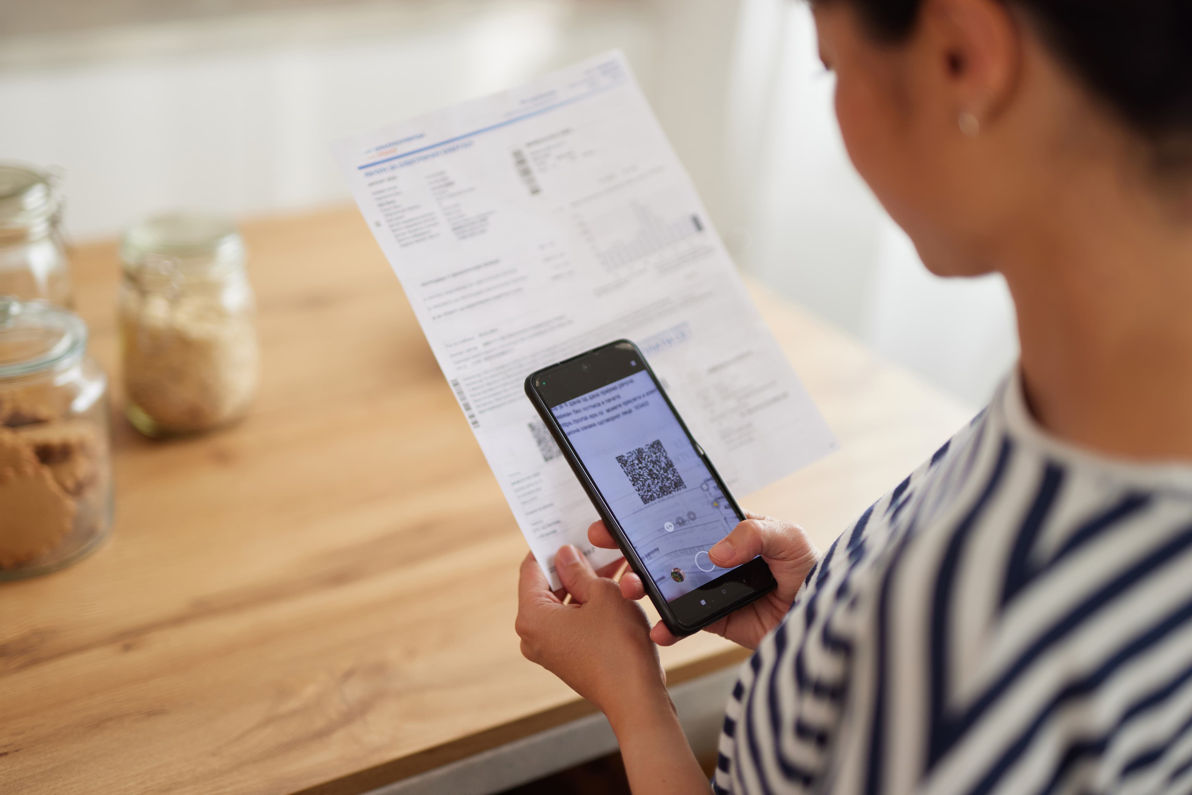 Remote worker receives USDC salary notification on smartphone, illustrating stablecoin payroll for freelancers in 2024